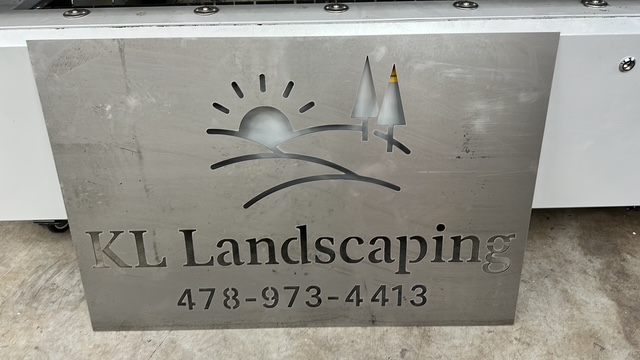 Custom laser-cut KL Landscaping metal business sign