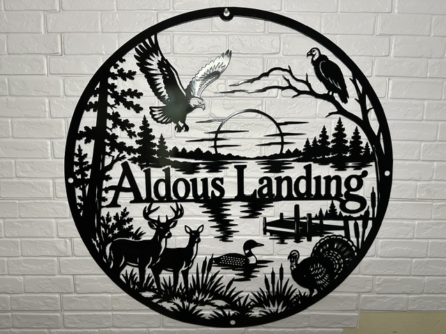 Custom wildlife metal sign featuring lake, deer, eagles and outdoor scenery by White Bear Fabrication