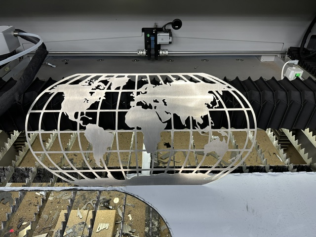 Detailed laser-cut metal world map design